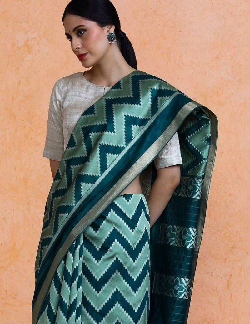 Green woven design saree with blouse