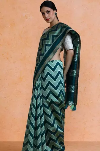 Green woven design saree with blouse
