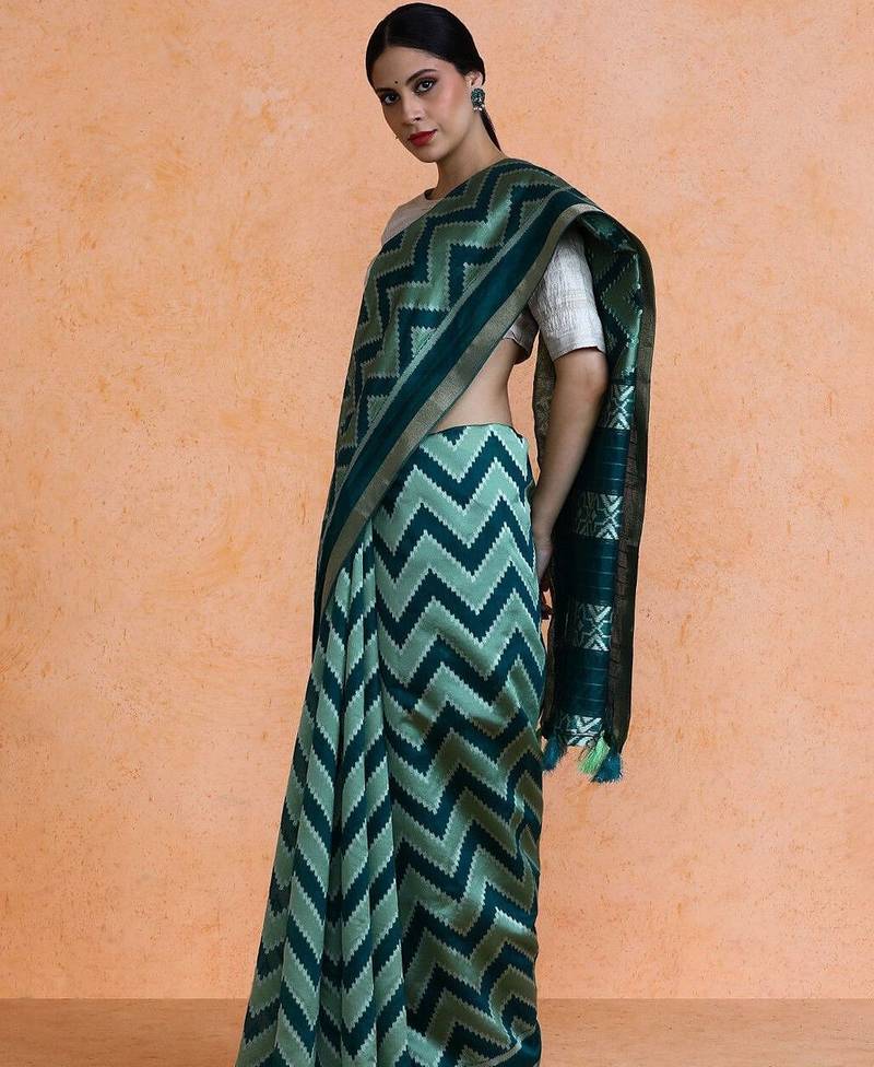 Green woven design saree with blouse