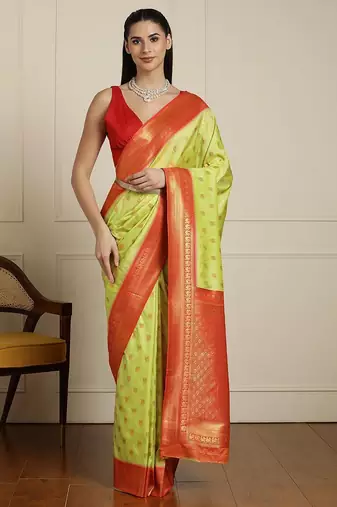 Green ethnic motifs woven design zari kanjeevaram saree