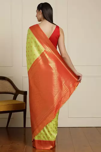 Green ethnic motifs woven design zari kanjeevaram saree