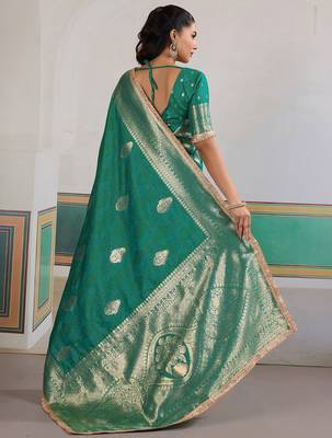 Teal ethnic motifs woven design zari saree with unstitched blouse 3