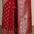 Red ethnic motifs woven design banarasi saree  with blouse piece
