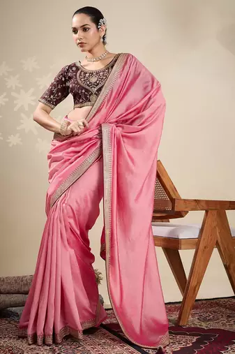 Peach women solid embellished border saree