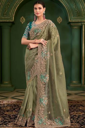 Green embroidered festive wear saree with matching unstitched blouse
