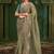 Green embroidered festive wear saree with matching unstitched blouse