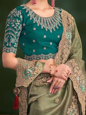 Green embroidered festive wear saree with matching unstitched blouse 4