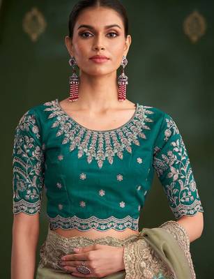 Green embroidered festive wear saree with matching unstitched blouse 5