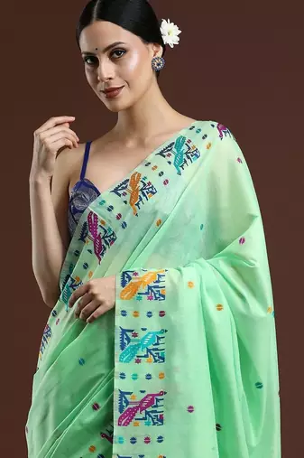 Green woven design muga saree with blouse