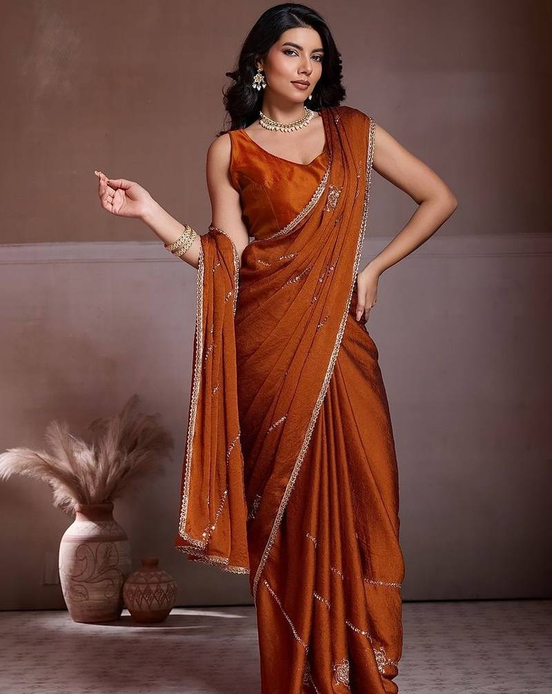Rust embroidered saree with unstitched blouse