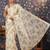 Off white floral printed organza sarees