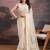 Beige floral embroidered saree with blouse piece