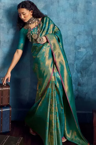 Green woven design kanjeevaram saree with blouse piece