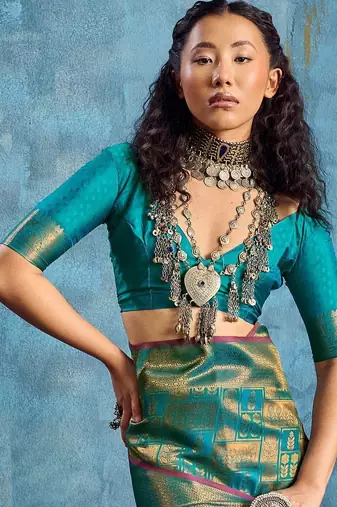 Green woven design kanjeevaram saree with blouse piece