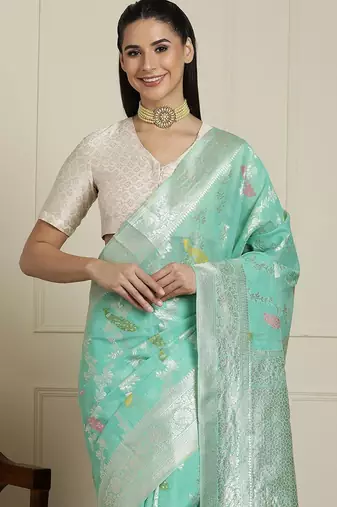 Green floral motif printed banarasi saree with blouse piece