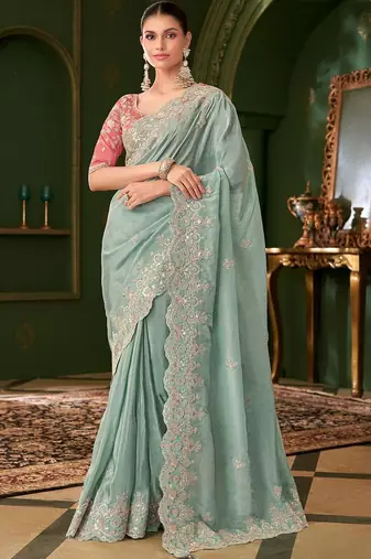 Blue embellished festive wear saree with matching unstitched blouse