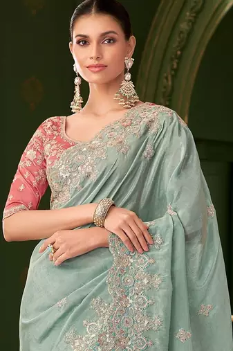 Blue embellished festive wear saree with matching unstitched blouse