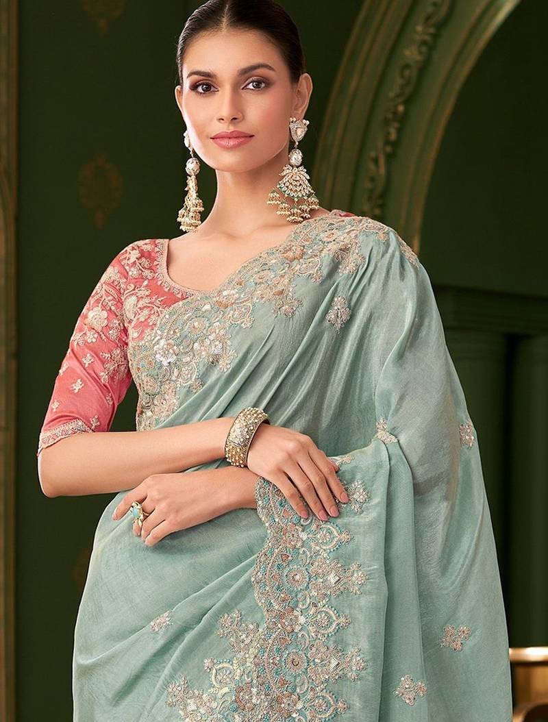 Blue embellished festive wear saree with matching unstitched blouse