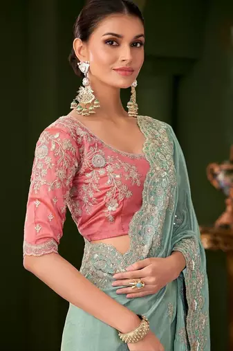 Blue embellished festive wear saree with matching unstitched blouse