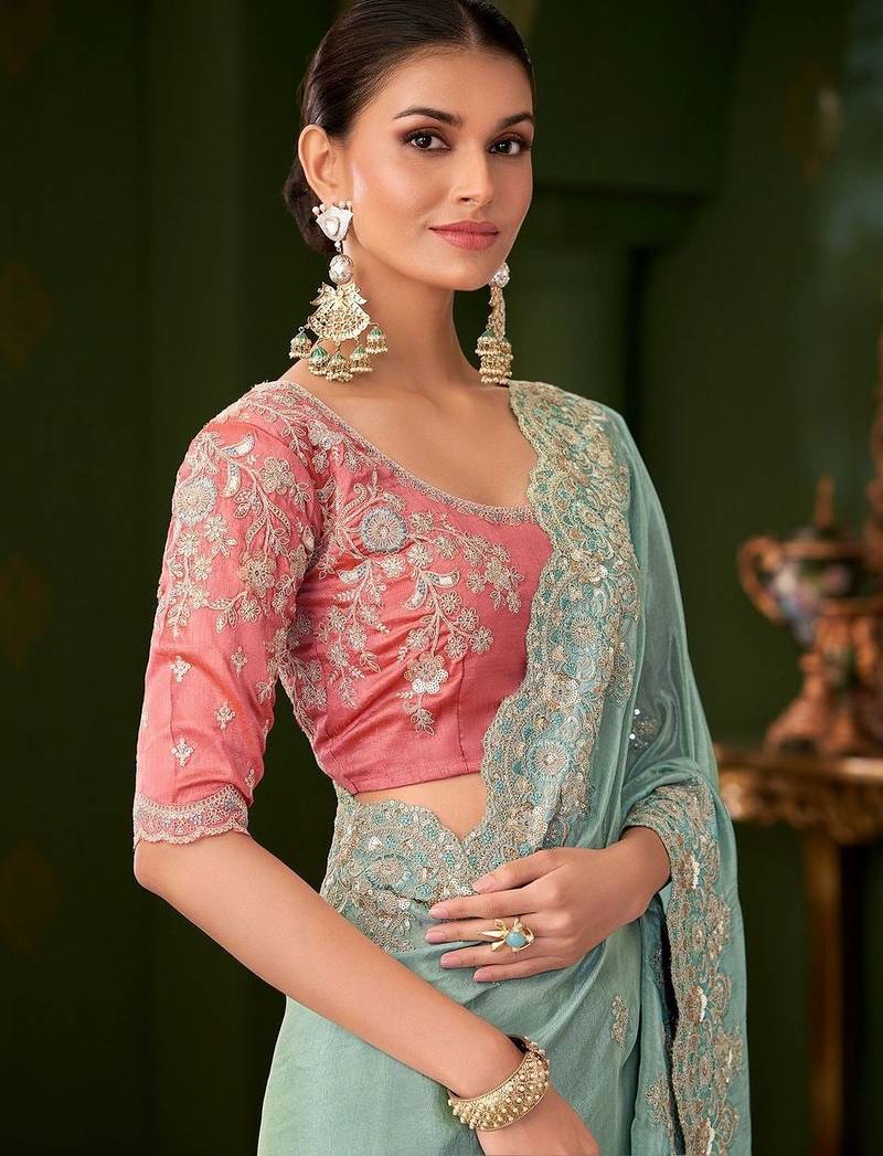 Blue embellished festive wear saree with matching unstitched blouse