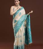 Beige woven design saree with blouse