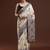 Beige woven design saree with blouse