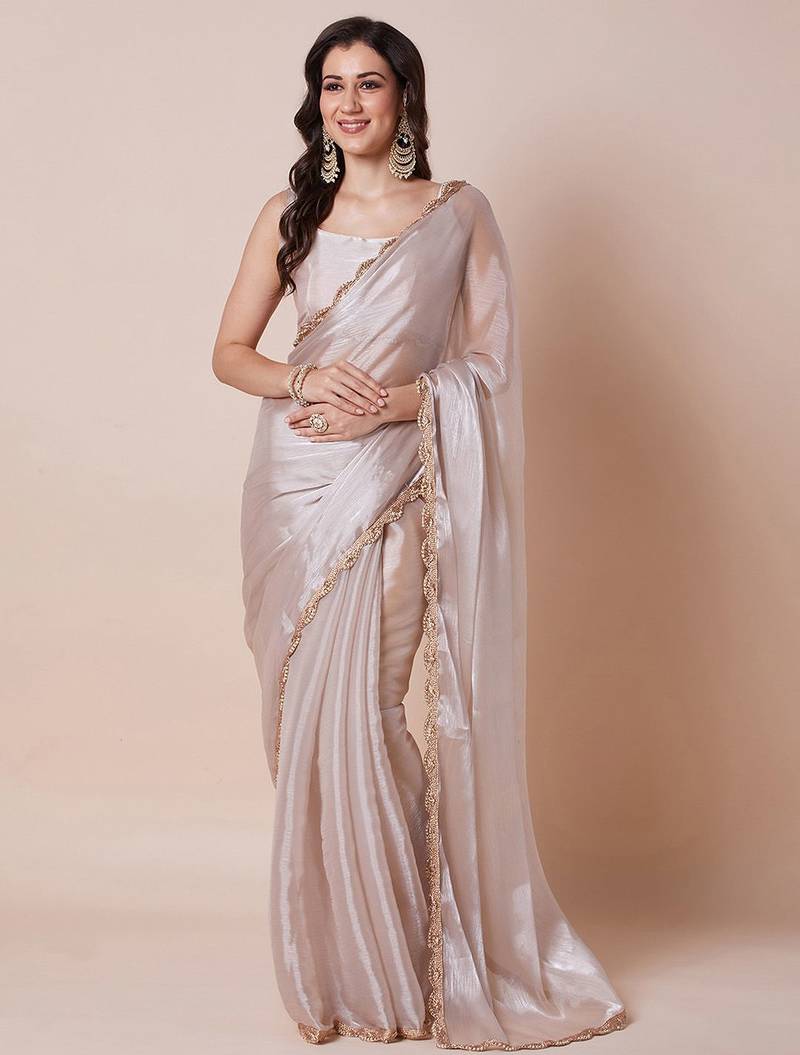 Cream embellished border organza saree with unstitched blouse