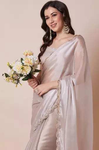 Cream embellished border organza saree with unstitched blouse