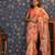 Peach floral printed organza embellished border saree