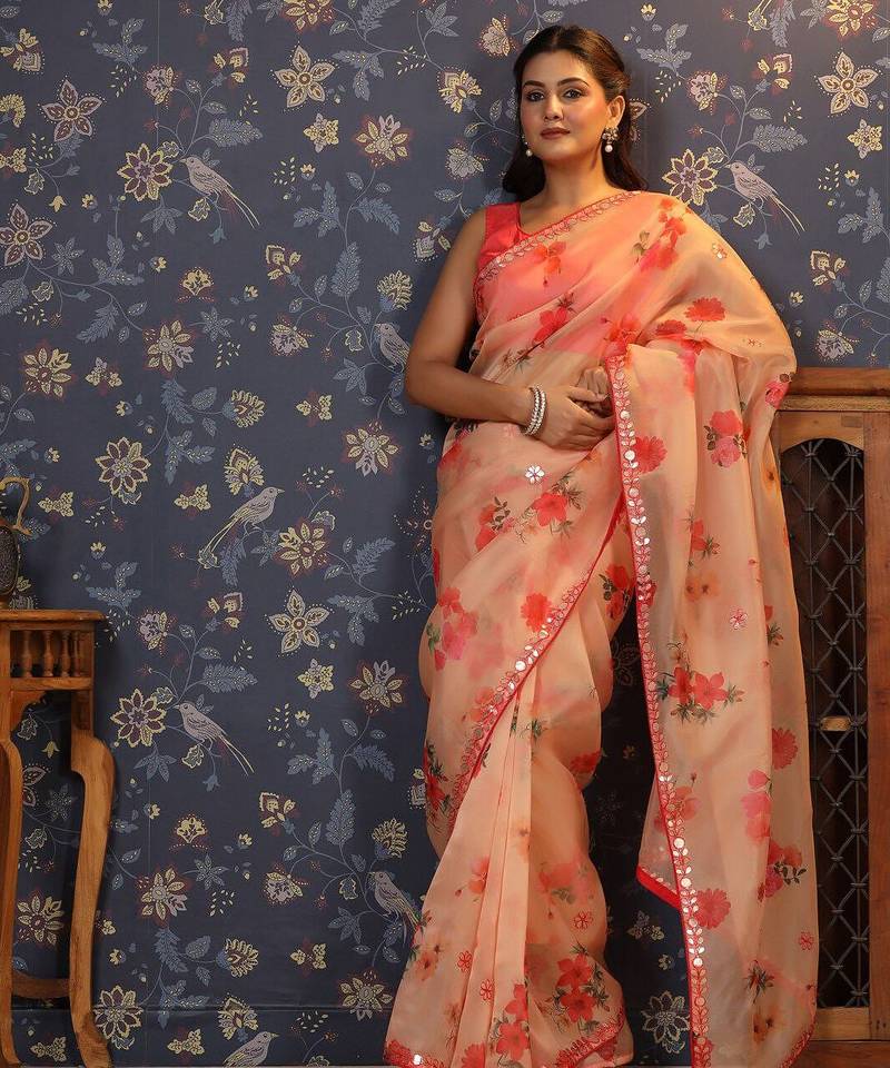 Peach floral printed organza embellished border saree