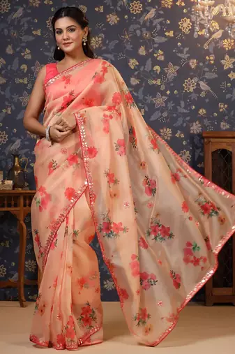 Peach floral printed organza embellished border saree