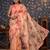 Peach floral printed organza embellished border saree