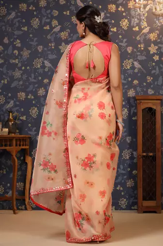 Peach floral printed organza embellished border saree
