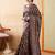 Brown ethnic motifs digital printed silk blend saree with unstitched blouse
