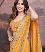 Yellow bandhani design embroidered saree with blouse piece