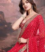 Red embroidered bandhani saree with blouse piece