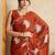 Rust embroidered saree with blouse piece
