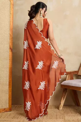Rust embroidered saree with blouse piece