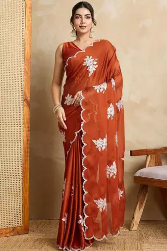 Rust embroidered saree with blouse piece