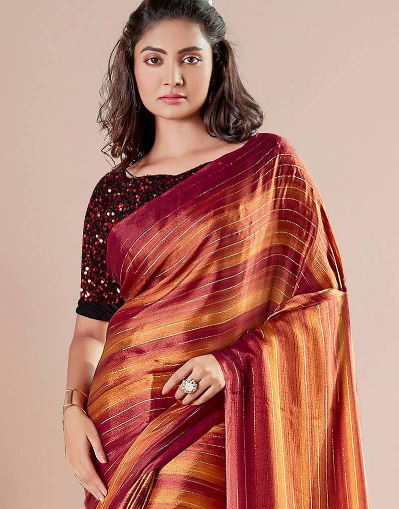 Rust striped poly georgette solid party wear saree