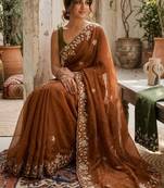 Brown ethnic motifs embroidered pure georgette saree