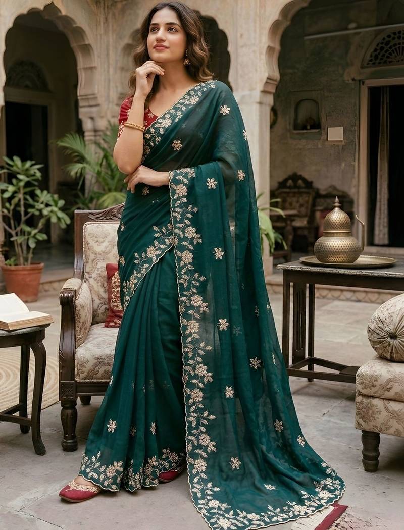 Teal ethnic motifs zari pure georgette saree
