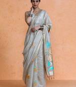 Beige woven design muga sarees with blouse piece