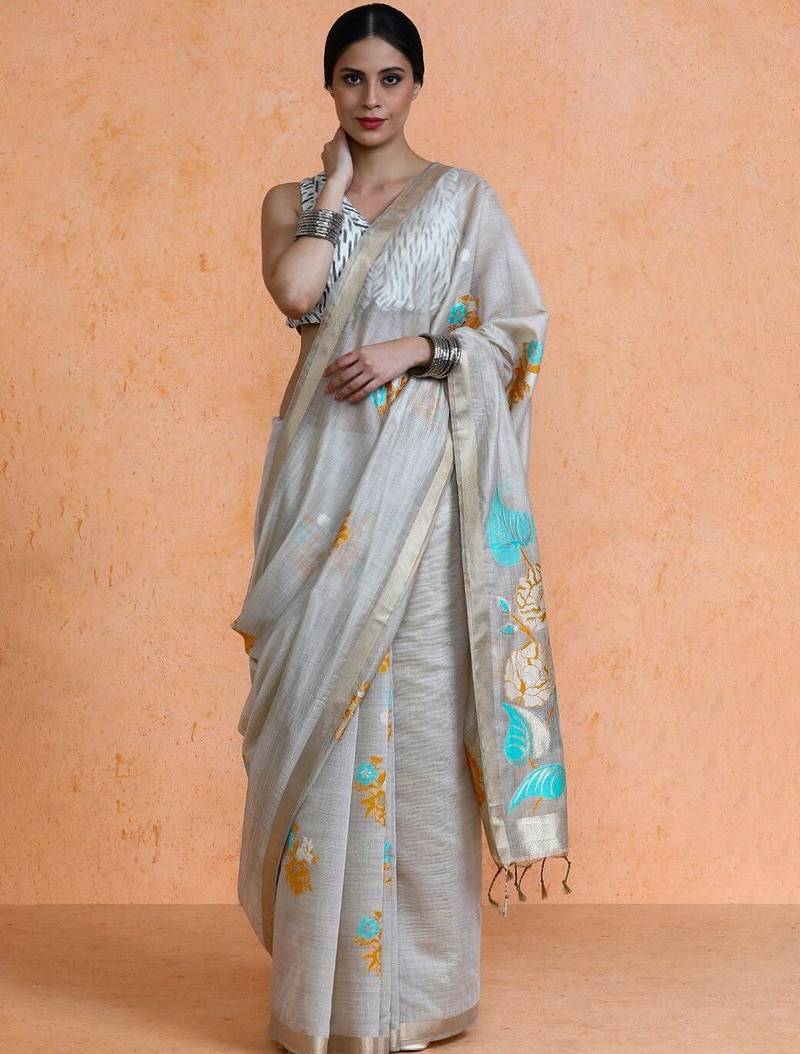 Beige woven design muga sarees with blouse piece