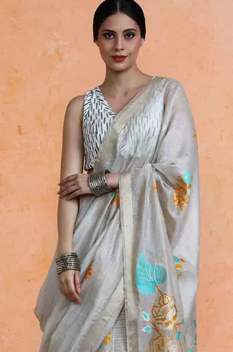 Beige woven design muga sarees with blouse piece