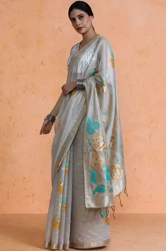 Beige woven design muga sarees with blouse piece
