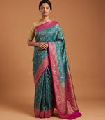Green satin woven saree with blouse