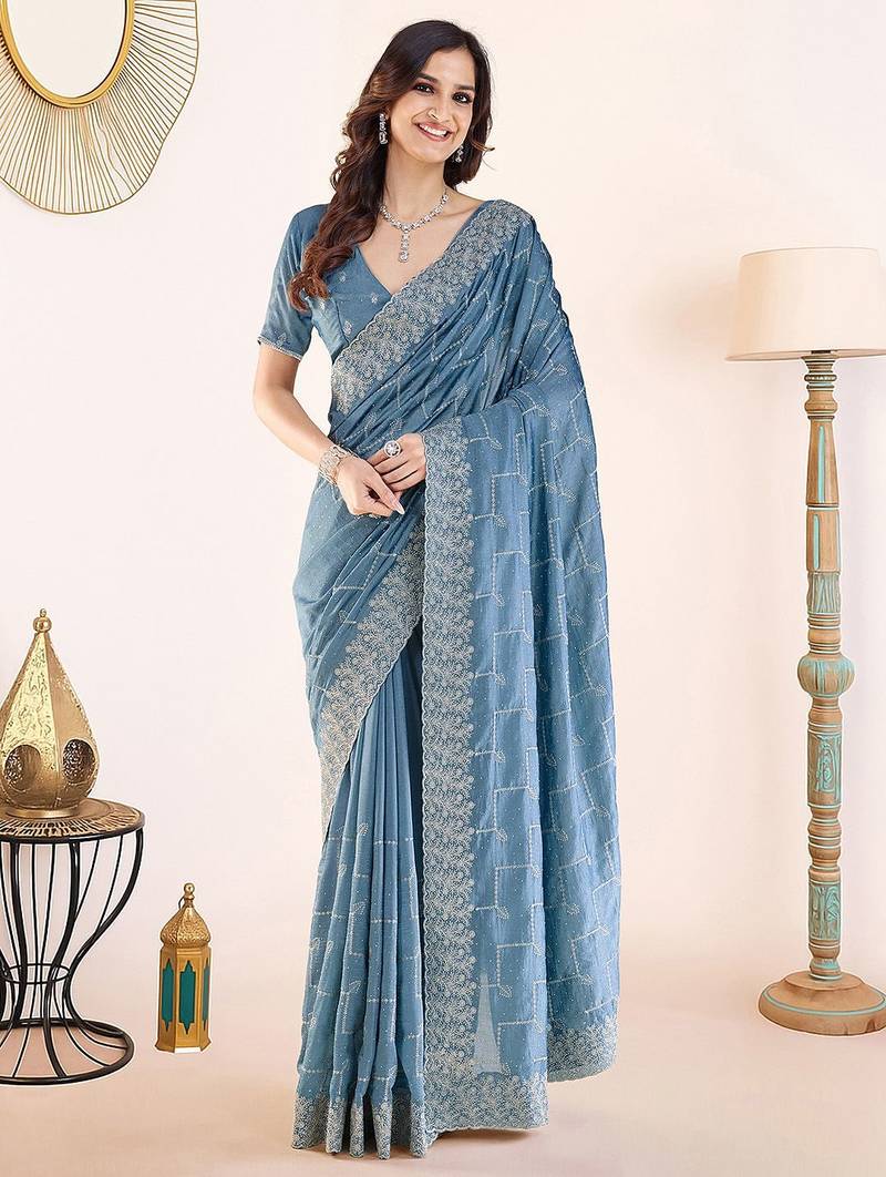 Blue embroidered festive wear saree with matching blouse