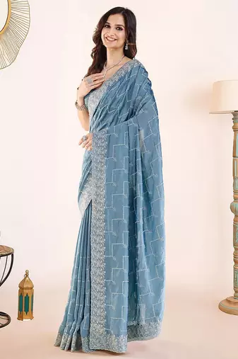 Blue embroidered festive wear saree with matching blouse