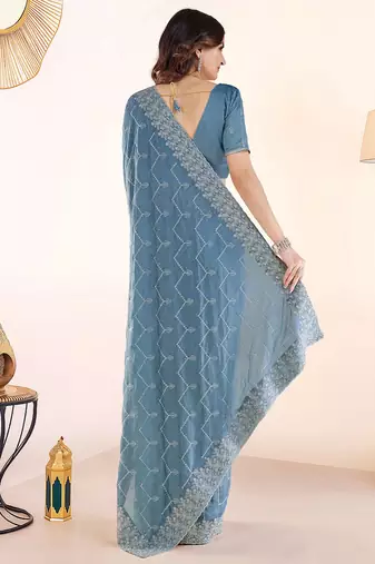 Blue embroidered festive wear saree with matching blouse